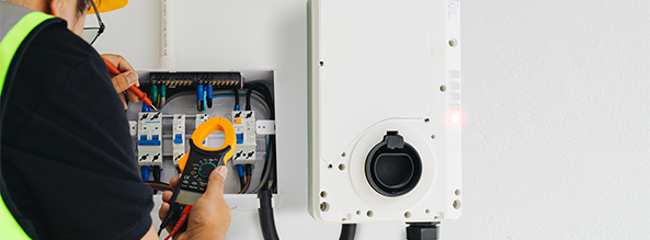 Electrician installing a charger